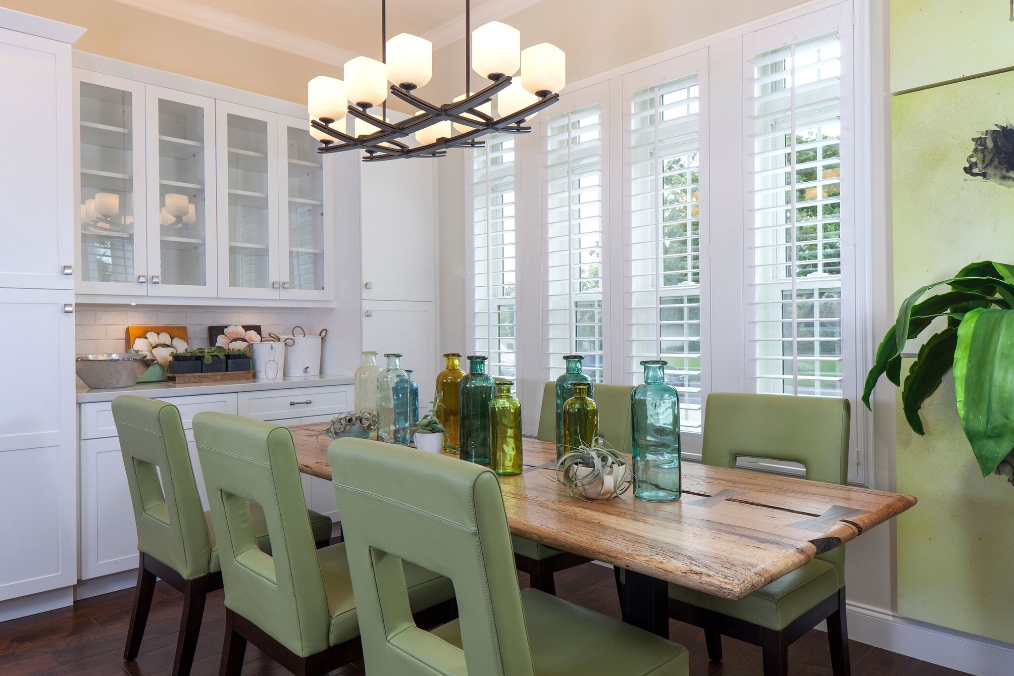White custom shutters in a kitchen’s dining area in Fresno, California